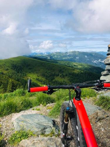 a red bike parked on top of a mountain at Ferienhaus Michael in Bad Kleinkirchheim
