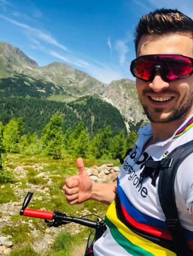 a man giving a thumbs up while riding a bike at Ferienhaus Michael in Bad Kleinkirchheim