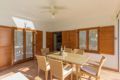 a dining room with a table and chairs at Villa Asi in Vrsar