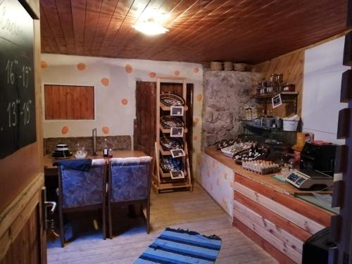 a kitchen with a counter and a table in a room at Apartment Nazbauerhof in Rohr im Gebirge