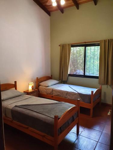 Postelja oz. postelje v sobi nastanitve Ventana a la Selva Casa Residencial