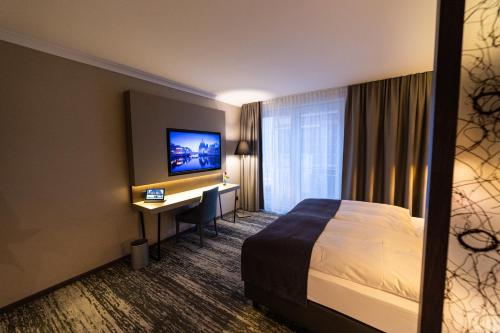 Postel nebo postele na pokoji v ubytování Kranz Parkhotel