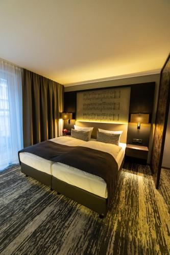 Postel nebo postele na pokoji v ubytování Kranz Parkhotel