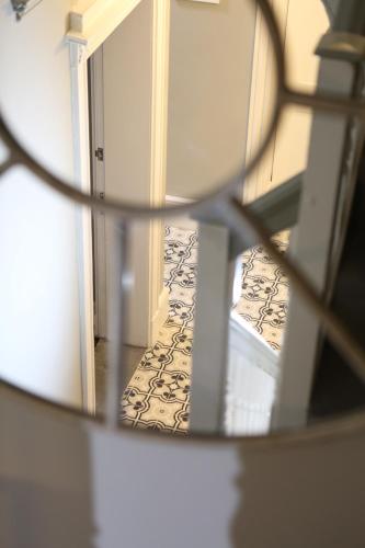a reflection of a hallway in a mirror at no 12 - Stunning Self Check-in Apartments in Worcester Centre in Worcester