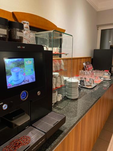 a coffee machine on a counter in a hotel room at INVITE Hotel an der Kaiserburg in Nürnberg