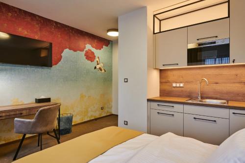 Kuchyň nebo kuchyňský kout v ubytování Hotel Alfréd a Hermína