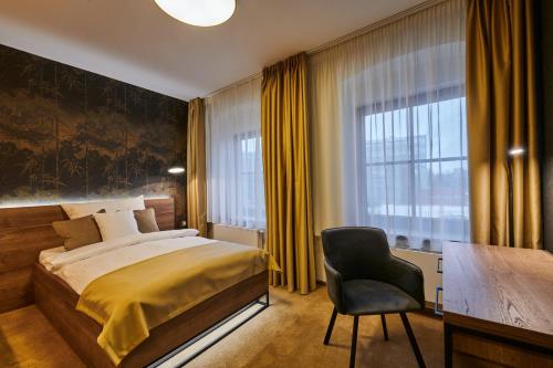 En eller flere senger på et rom på Hotel Alfréd a Hermína