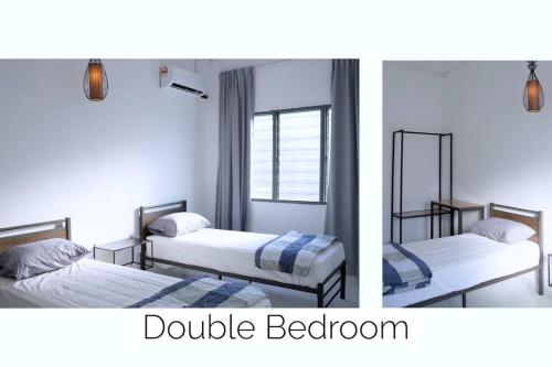 a bedroom with two beds and a double bedroom at The Pigeon Alor Akar Guest House in Kuantan