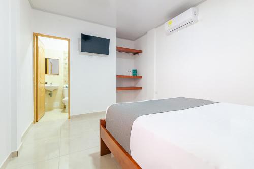 Ένα ή περισσότερα κρεβάτια σε δωμάτιο στο Hotel Tu Casa Bambú
