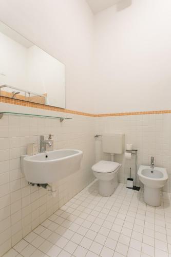 a bathroom with a sink and a toilet at Canaletto Apartments in Venice