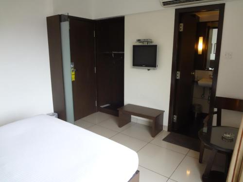 Postel nebo postele na pokoji v ubytování Shantai Hotel