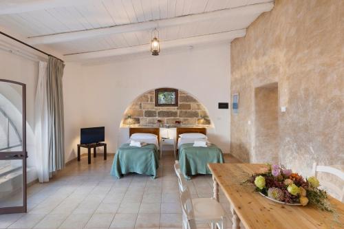 Katil atau katil-katil dalam bilik di Masseria Zanzara