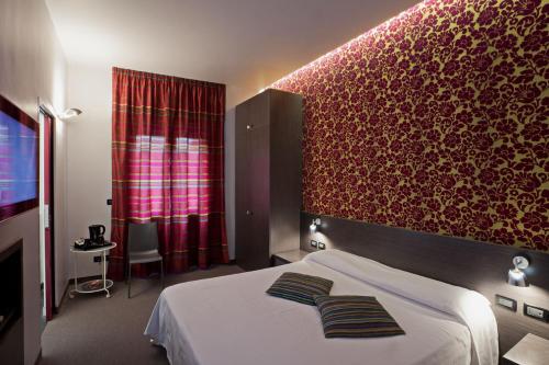 Postel nebo postele na pokoji v ubytování MA Hotel