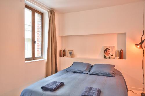 מיטה או מיטות בחדר ב-La maison du pêcheur