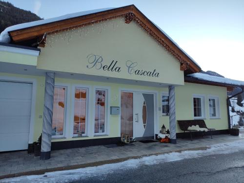 a building with a sign that reads bella cazaria at Apart Bella Cascata in Kappl