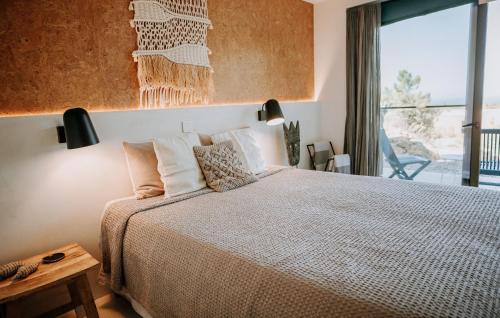 Säng eller sängar i ett rum på Eco-lodge Villa Epicurea