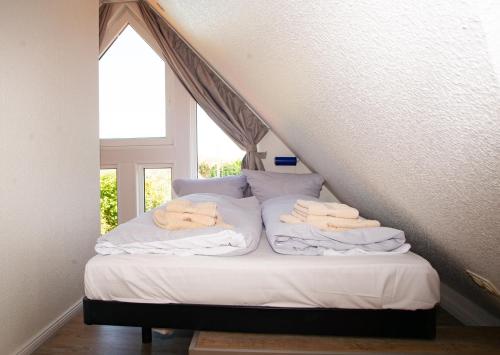 Een bed of bedden in een kamer bij Ostut