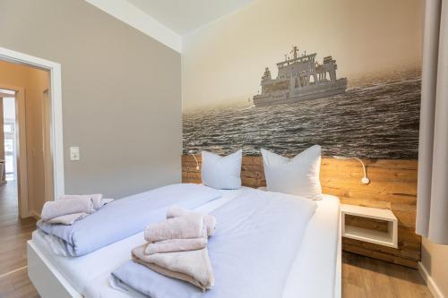 Postel nebo postele na pokoji v ubytování Haus Inselanker Kajüte 07