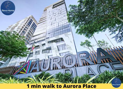a large building with a sign in front of it at Revo Home at Pavilion Bukit Jalil in Kuala Lumpur