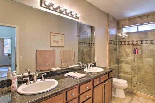 a bathroom with two sinks and a shower at Scottsdale Condo with Pool Walk to Kierland Resort in Scottsdale