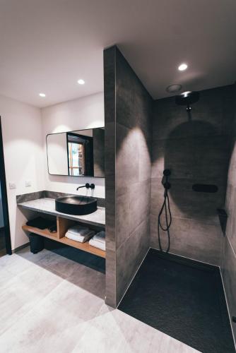 a bathroom with a sink and a mirror at La ferme d'Edouard - Les Fermes Ardéchoises in Labatie-dʼAndaure