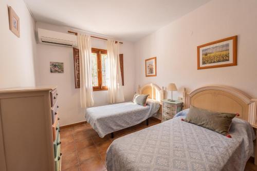 Postel nebo postele na pokoji v ubytování Villa Tropicana