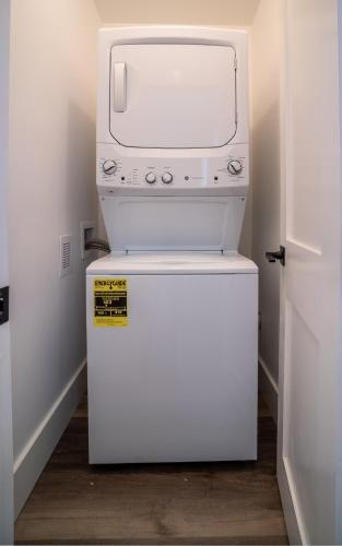a microwave sitting on top of a refrigerator at Plush 2-bed apt in Riverside Heights! in Reno
