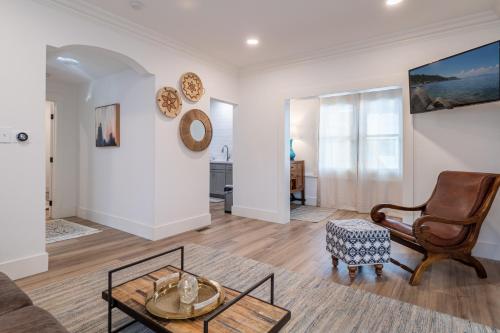 a living room with a couch and a chair at Plush 2-bed apt in Riverside Heights! in Reno