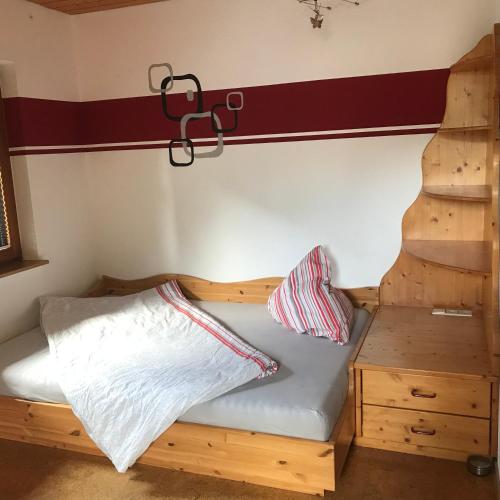 a bed with two pillows on it in a room at Wenzels Ferienwohnung im Südschwarzwald in Stühlingen