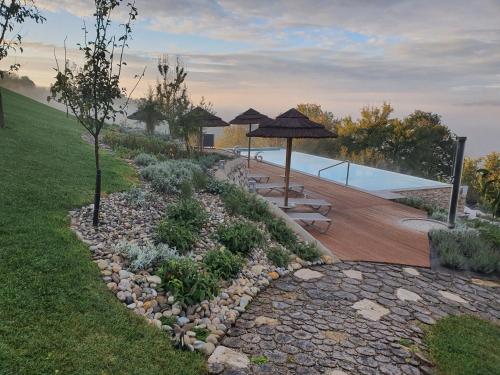 a garden with a swimming pool and a pool at B&B Villa Angelina in Rogaška Slatina