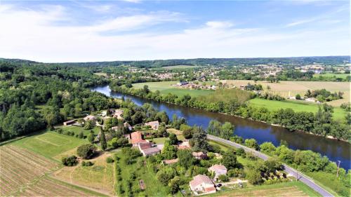 an aerial view of a village next to a river at Manoir du Bois Mignon in Le Fleix
