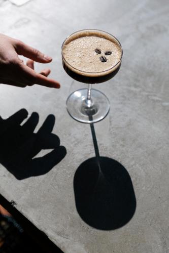 a person is reaching for a table with a hand at Casa Hoyos - Hotel Boutique in San Miguel de Allende