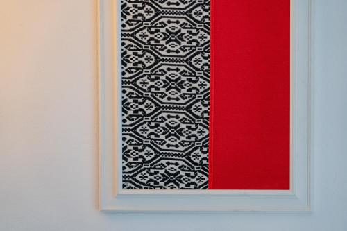 a framed picture of a black and white pattern at Costa Paradiso Resort in Costa Paradiso