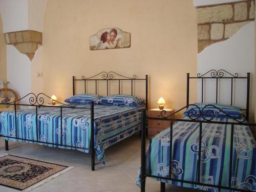 Giường trong phòng chung tại La Corte Antica