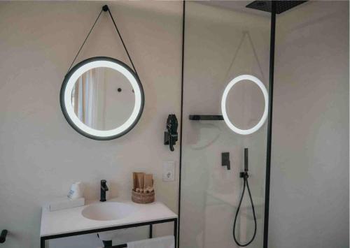 a bathroom with a sink and a mirror on the wall at Les Quingles in Calders