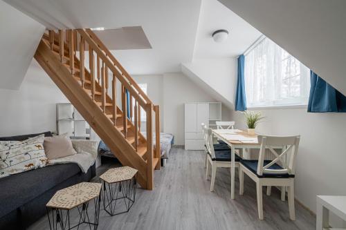 a living room with a couch and a table at Marcebila Abertamy in Abertamy