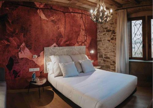 מיטה או מיטות בחדר ב-Les Quingles