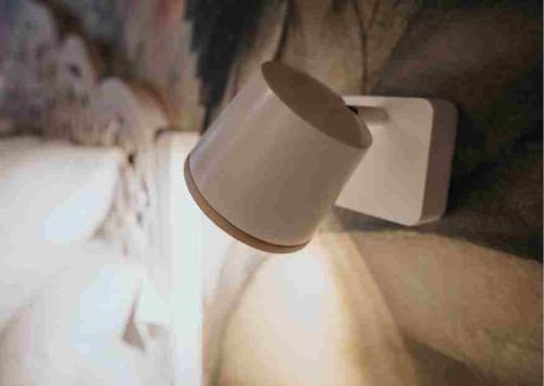 a white cup is hanging from a lightswitch at Les Quingles in Calders