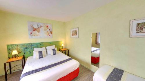 Katil atau katil-katil dalam bilik di Hotel du Mas