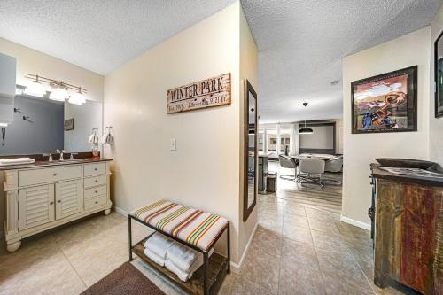 a living room with a sink and a counter top at Snowblaze Studio in Winter Park
