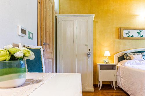 Postel nebo postele na pokoji v ubytování B&B Alla Loggia dell'Imperatore