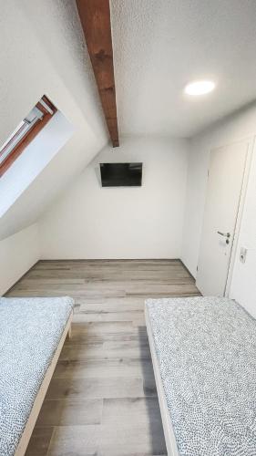 Ένα ή περισσότερα κρεβάτια σε δωμάτιο στο Mulinhouse Lingenfeld