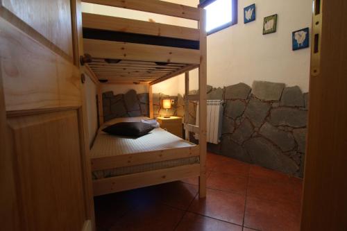a bedroom with a bunk bed in a room at Casa Vacanze Borgo Borghese in SantʼAlessio Siculo