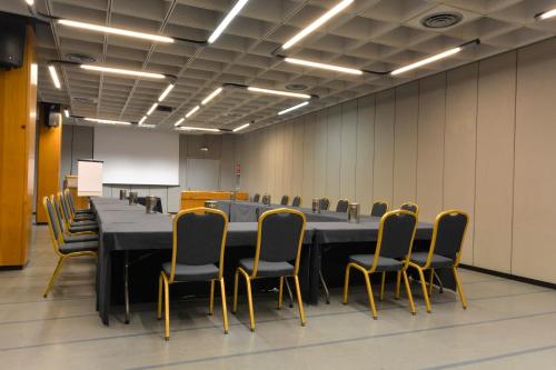 a large conference room with a long table and chairs at Grand Hotel Tiziano E Dei Congressi in Lecce