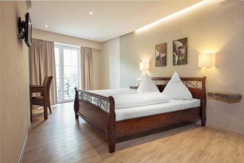 Voodi või voodid majutusasutuse Hotel Filla Andre toas