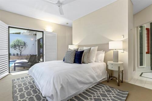 Ένα ή περισσότερα κρεβάτια σε δωμάτιο στο Retreat to tranquillity, Noosa Heads