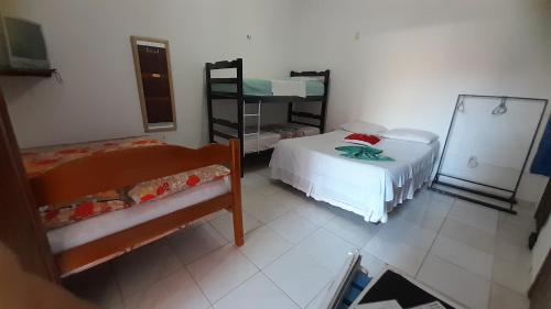 Una cama o camas en una habitación de Pousada Subindo as Dunas
