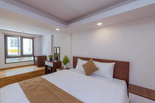 Giường trong phòng chung tại Khanh Uyen 2 Hotel