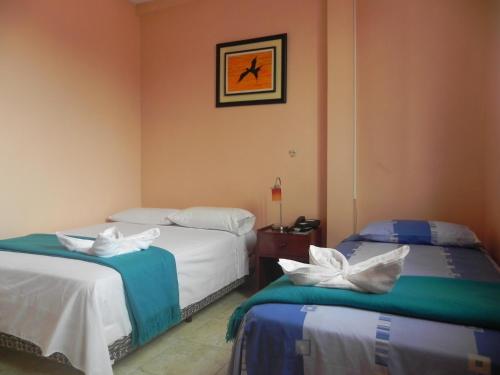 Postel nebo postele na pokoji v ubytování Hostal La Posada De Jose Carlos