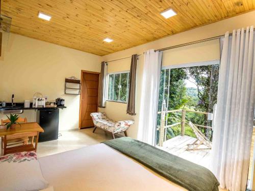 Postel nebo postele na pokoji v ubytování Hospedagem Terra de Aquários